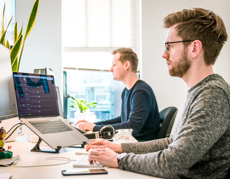 Two professionals reviewing the context of a project